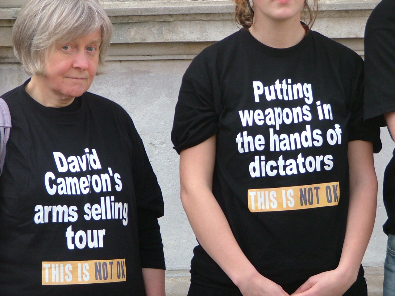 This is NOT OK -CAAT petitionioners wore tee-shirts with a message 