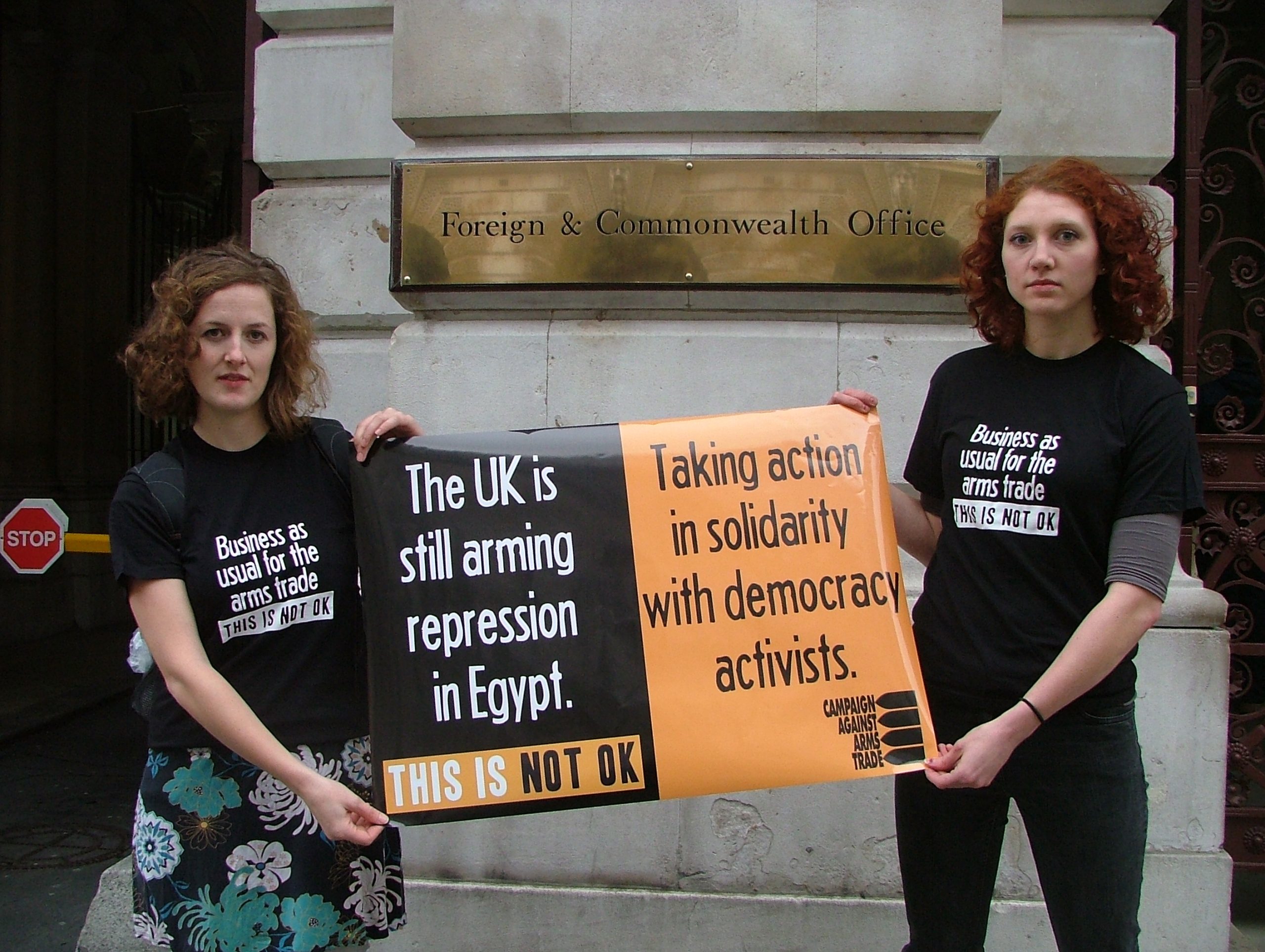 Campaigners stand out Foreign Office with banner saying UK is still arming repression in Egypt