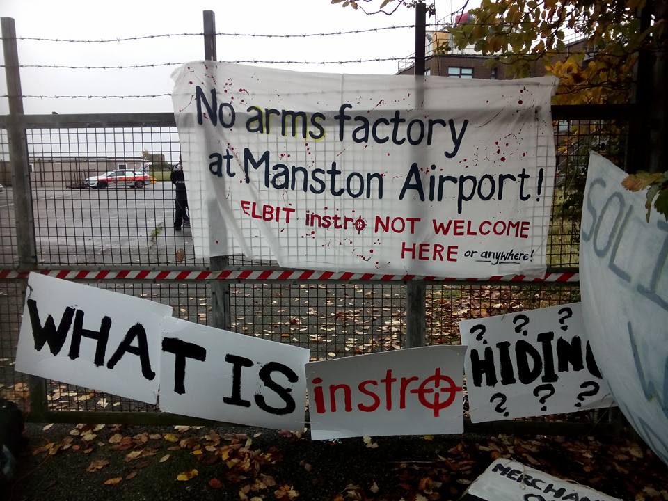 anti-arms trade banners on the railings outside Manston Airport