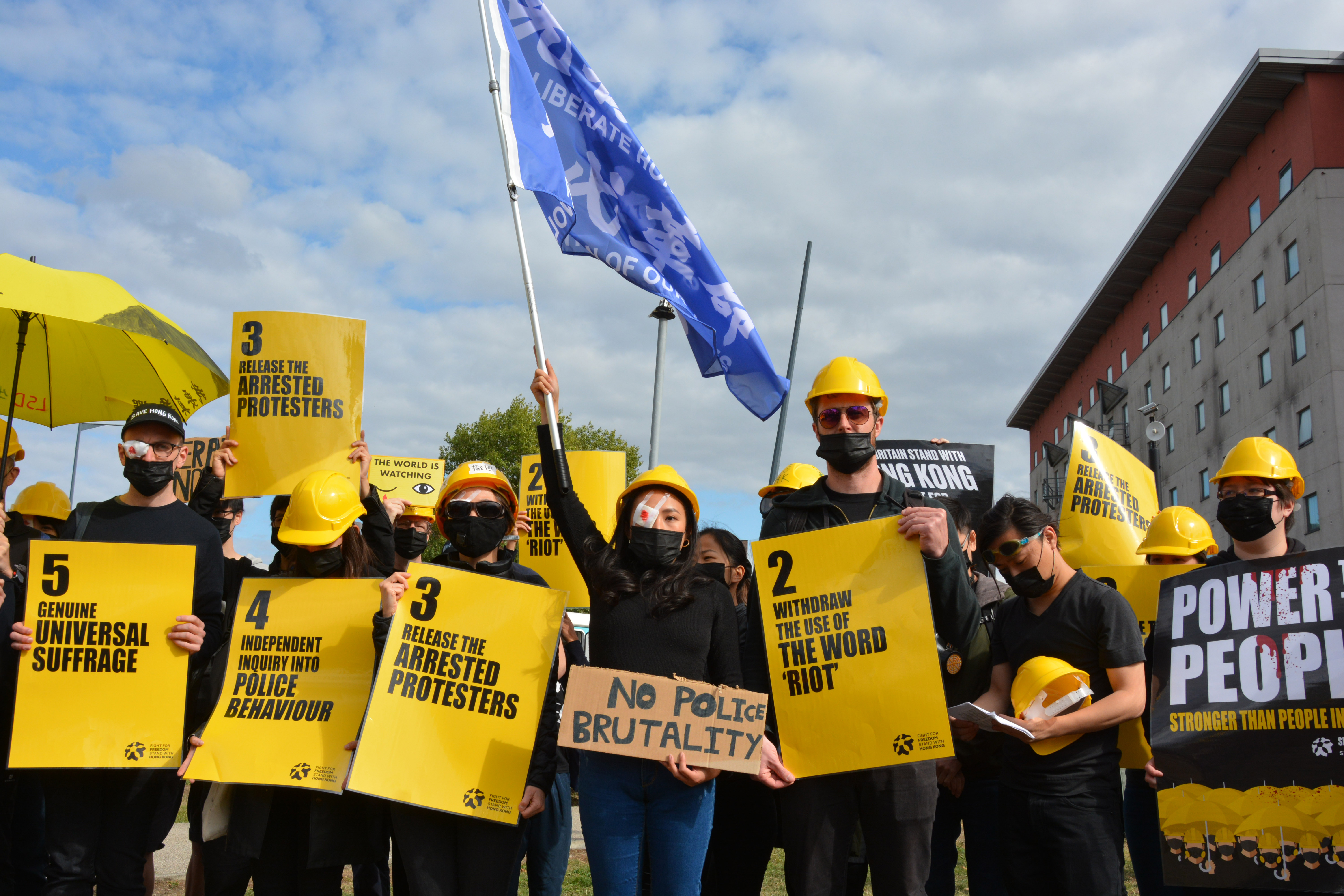 Pro-democracy campaigners protest in solidarity with Hong Kong umbrella movement outside DSEI