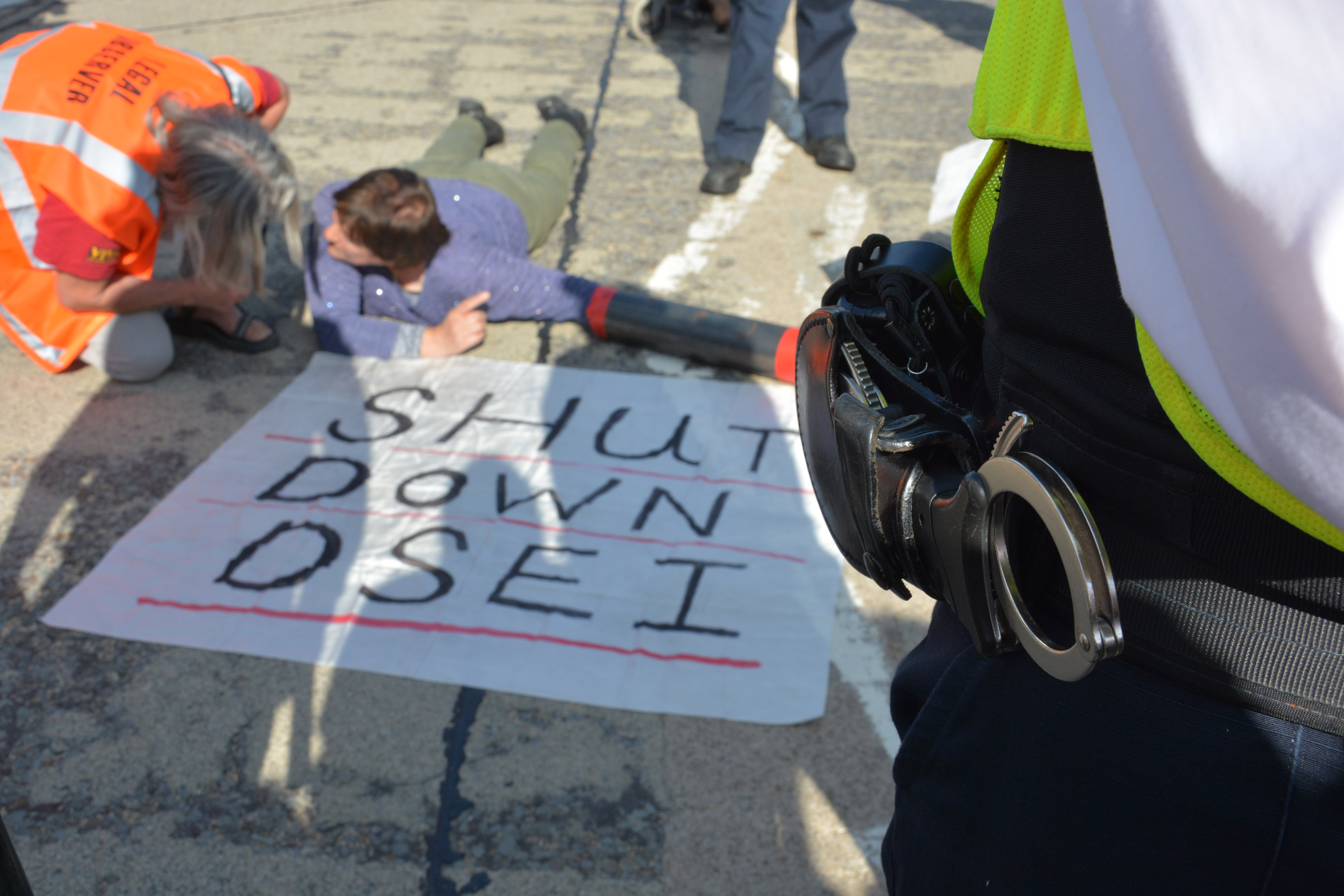 Activists 'lock-on' to block road outside DSEI