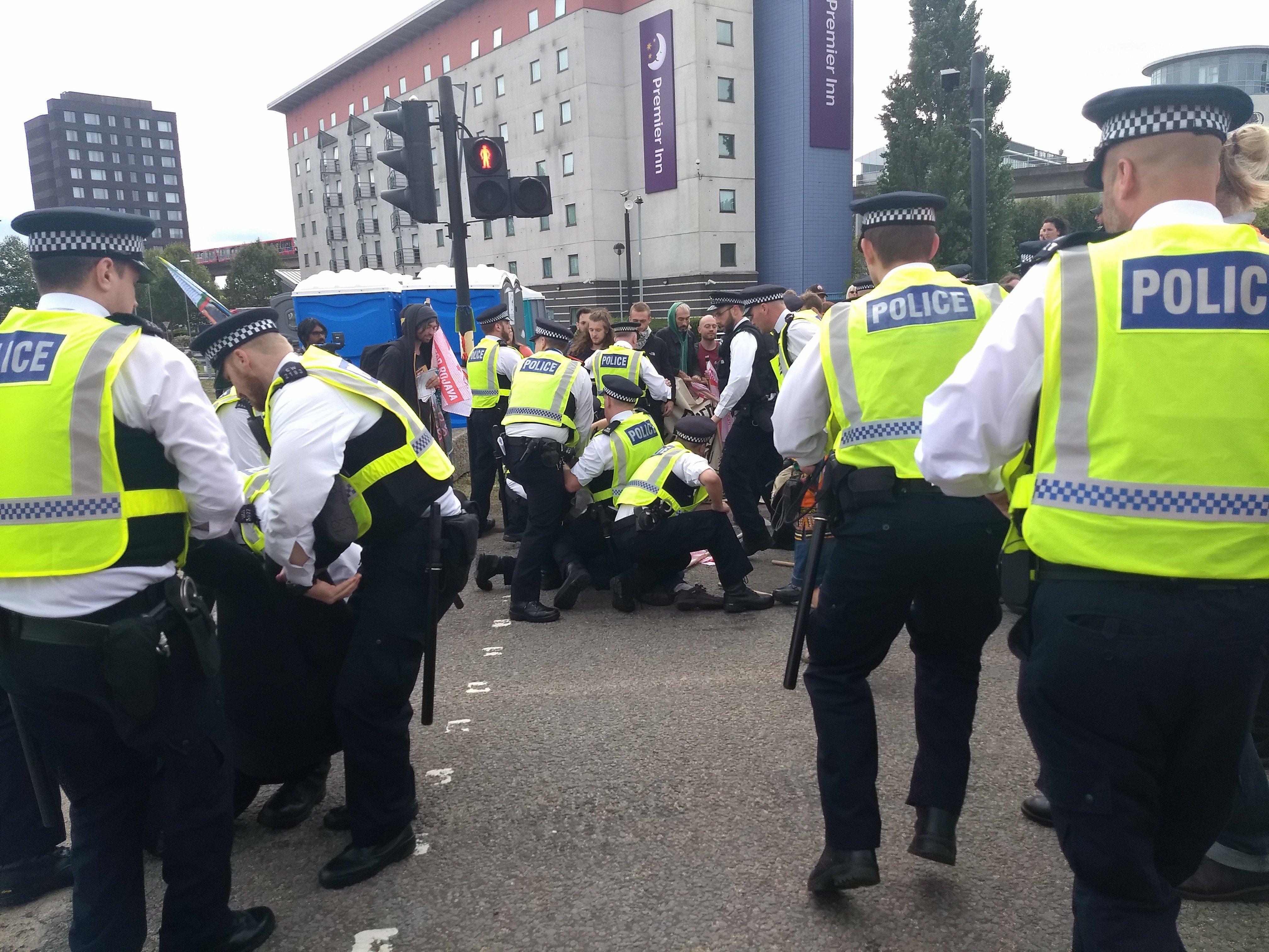Police arrest activist in road outside DSEI arms fair
