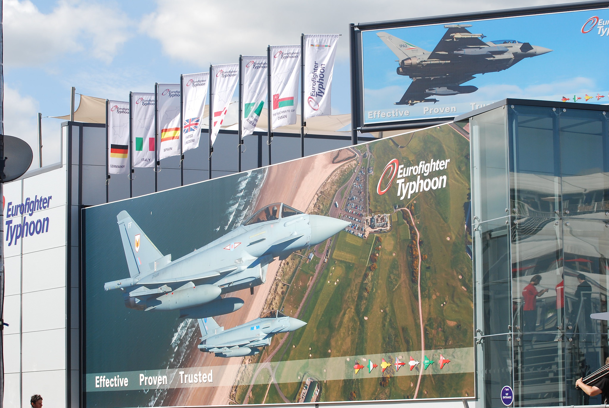 Eurofighter Typhoon large outdoor poster captioned Effective, proven, trusted. Flats behind include German, Spain, Italy UK