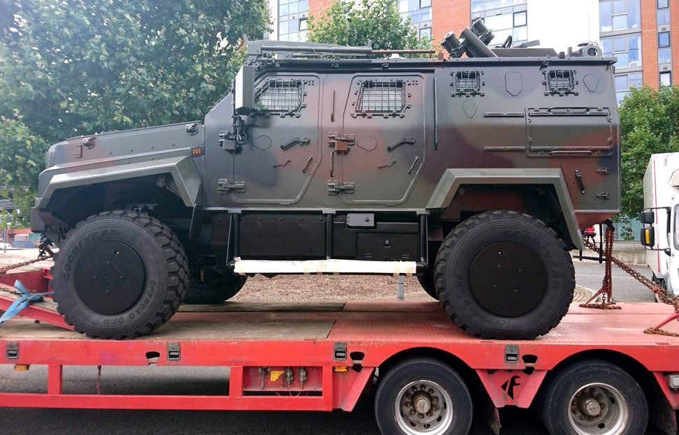 picture of an armoured vehicle on a flat-bed truck