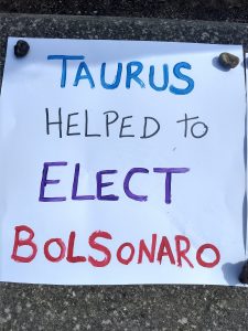 Hand painted notice saying Taurus helped to elect Bolsonaro