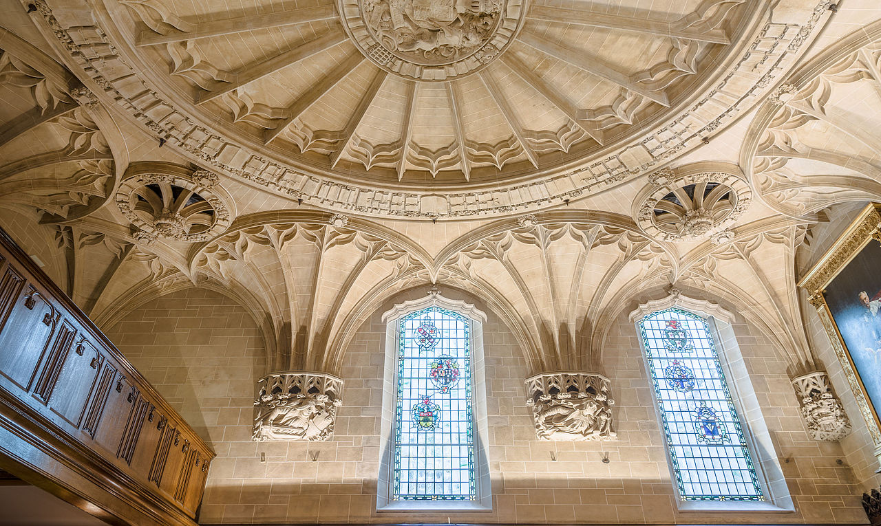 light coloured stone ceiling and stained glass windows