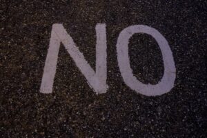 'NO' in white paint on pavement