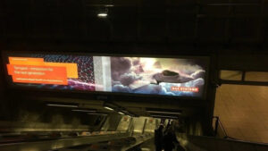 BAE Systems ad in Westminster Tube, showing deadly weapons with a corporate message