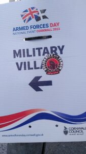 Armed Forces Day military village sign with a solidarity with Yemen sticker on it