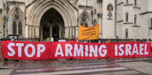 A huge banner held outside the Royal Courts of Justice