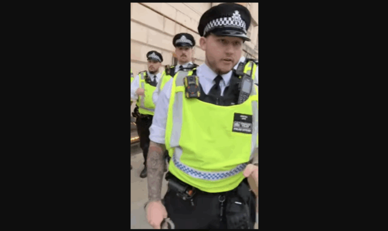 Three police officers about to make an arrest