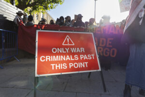 Road sign saying "only war criminals past this point"