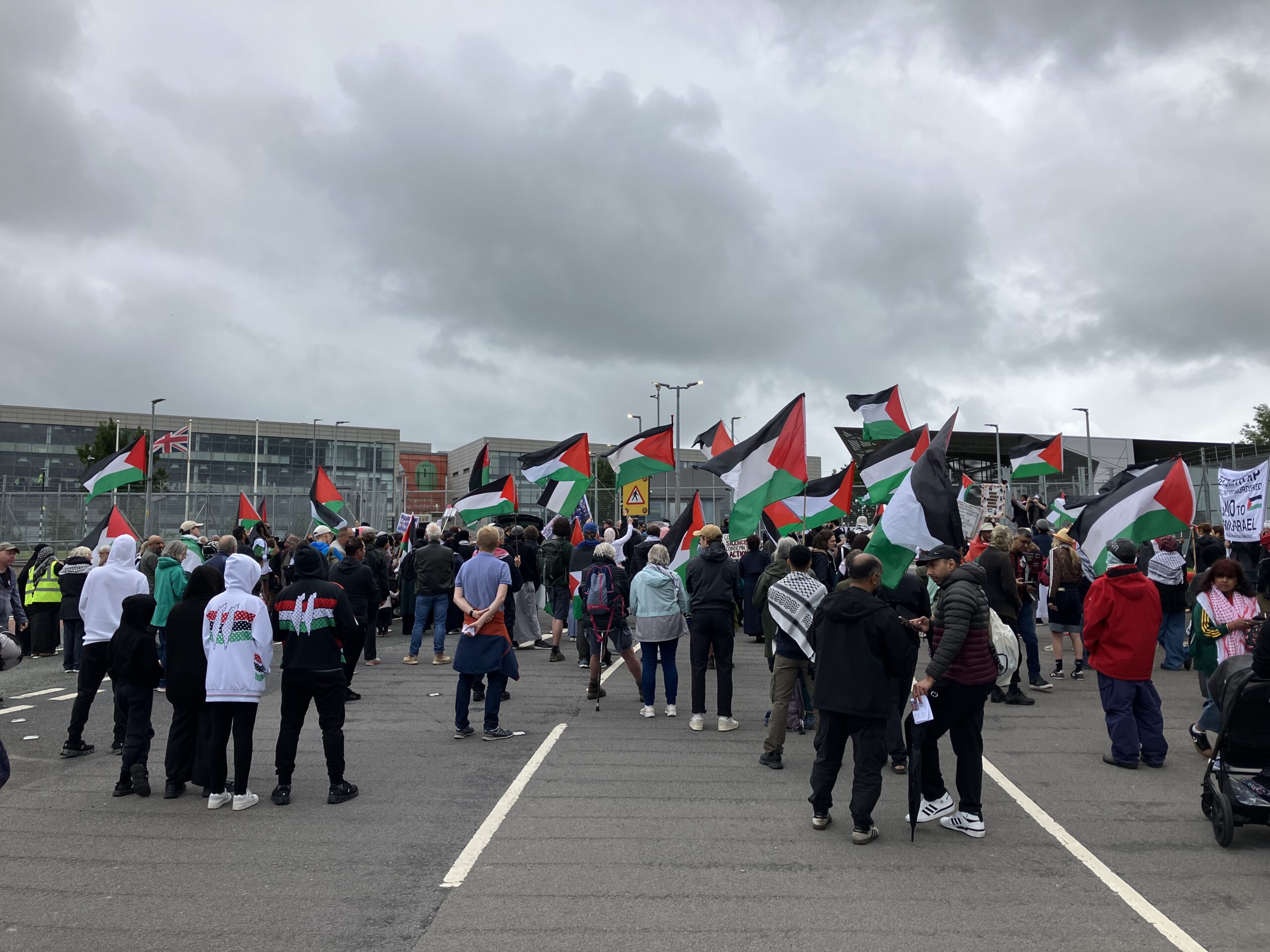 Protestors wave Palestinian flags outside BAE Systems, Samlesbury