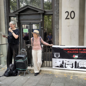 A London CAAT speaker outside the Palantir offices in Soho Square