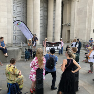 A crowd of campaigners outside the Ministry of Defence, home of UKDSE